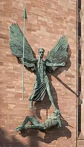 St Michael's Victory over the Devil, a 1958 sculpture by Jacob Epstein on the wall of the new Coventry Cathedral, England