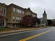 St Paul Street School (1927) and Church (1851) straddles the border between Blackstone, Massachusetts and North Smithfield, Rhode Island