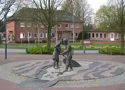 The town hall with a sculpture Jan und Gret symbolising the hard work of coastal fishermen before the onset of tourism