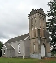 Church with a large square tower at the front