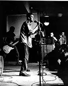 Stabb singing on stage at Washington, DC's Wilson Center