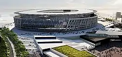A 3D rendering of a round stadium with two angular buildings leading up to it