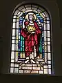 Stained-glass window depicting St John the Baptist