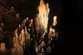 Stalactite that fell thousands of years ago and is now in the midst of stalagmites