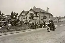 Stanley Woods on board a Moto Guzzi, passes the Bray Hill/Port-e-Chee Avenue junction, as he descends the hill during the 1935 TT Races.