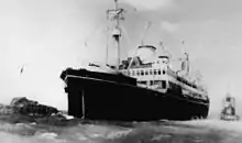MS Wanganella being towed from an entrance reef, 1947