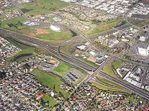 Goodwood Heights is in the lower left of this picture, with the interchange between the Auckland Southern Motorway and Southwestern Motorway in the background