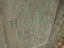 A stamp on a bridge reading State Highway Route 25