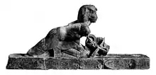 Kneeling statue of Osorkon III pushing a barque of Seker, from Karnak