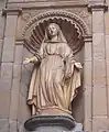 Statue in a niche on the side of the church