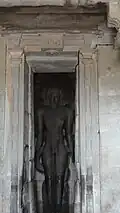 Standing statue in niche
