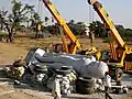 Idol being lifted by cranes