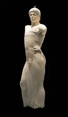 Marble statue of a young male charioteer