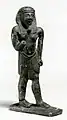 A statue in Ancient Egypt a Pharaoh wearing a Nemes