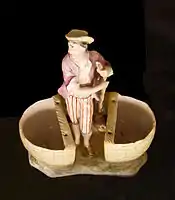 18th century figurine with condiment-holder