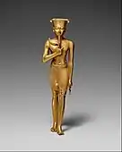 Ancient Egyptian statuette of Amun; 945–715 BC; gold; 175 mm × 47 mm (6.9 in × 1.9 in); Metropolitan Museum of Art