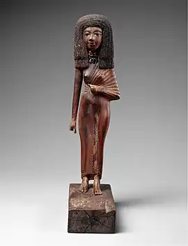 Statuette of the lady Tiye; 1390-1349 BC; wood, carnelian, gold, glass, Egyptian blue and paint; height: 24 cm; Metropolitan Museum of Art