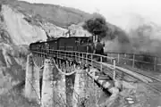 The steam train passing Zlaşti valley viaduct around 1930-1940
