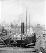 Steamer EC Pope in Detroit Dry Dock No 2, c. 1894.  Note machine shop in left background and Dry Dock Hotel in right background.