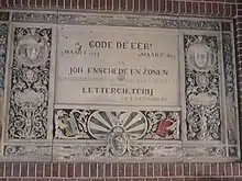 Memorial plaque to former printer of money, Johan Enschede (hangs in klokhuisplein gateway).