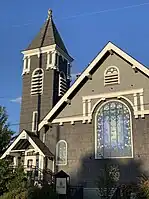 The facade of Steeplejack Brewing Company showing stained glass window