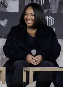 Photograph of director Stella Meghie sitting at an event in 2020.