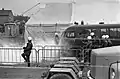 Riot police officers and an armored van outside the polling place.