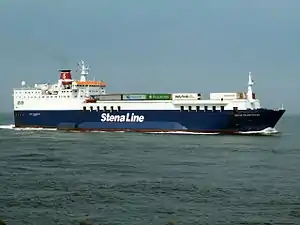 The ship 'Nordic Ferry' has an blue-coloured hull, a white superstructure and a red funnel. White lettering names the operator Stena Line. A number of lorries are visible on the deck.  The ship is at sea and making headway.
