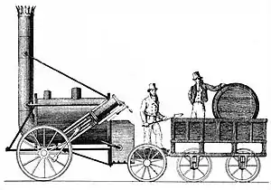 Cylindrical railway locomotive, with a very tall pipe at one end and a barrel-shaped tender at the other.