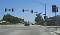 Typical example of traffic lights mounted on a wide street in California