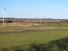 A 1200 yard shooting range with wind flags flying