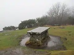 This stone table, a few yards back from the summit's cliff edge, marks views on the horizon