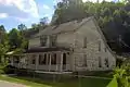 A Multi-family dwelling in the Stonega Historic District that is larger and deeper than the other units.