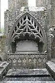15th-century sculptured tomb in the north wall of the chancel of Strade Friary