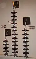 High-voltage strain insulators used on 66 kV, 230 kV and 115 kV AC lines. The number of insulator skirts varies with voltage and atmospheric conditions.