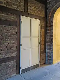 Door in the wall of the gateway