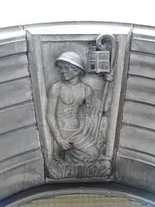 Depiction of a miner with a canary in a cage