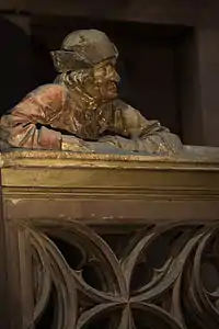 The man on the balustrade (south transept)