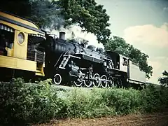 No. 90 pulling a tourist excursion tender-first on July 19, 1984.