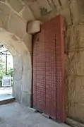 Door, photographed from within the gate