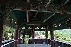 Wooden gatehouse, above the stone gate