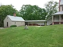 Looking North-West. Kitchen and Laundry building on the West end of the Main House at Sully.  Kitchen is connected by a covered walkway.