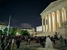 A crowd standing outside the Supreme Court building