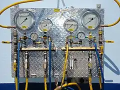 A surface supply panel for four divers showing four pneumofathometer gauges