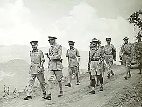 Prince Amedeo speaks to Mosley Mayne (leftmost) during the surrender.