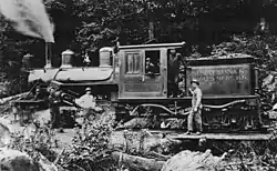 Steam locomotive and five persons