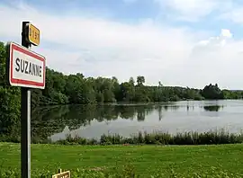 The lake and entrance sign to Suzanne