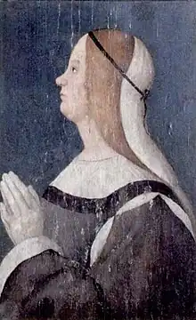 Painting of Seraphina Sforza holding her hands together in prayer