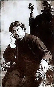 Image of Swami Vivekananda relaxing in a chair