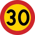 Swedish 30 km/h speed limit – the yellow background provides a contrast in case snow covers the background against which one perceives the road sign.